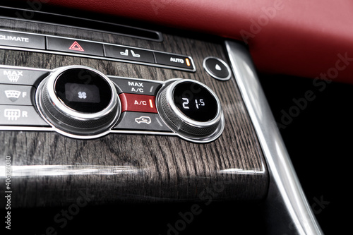 Air conditioning button inside a car. Climate control AC unit in the new car. Modern car interior details. Car inside. Car interior © Aleksei