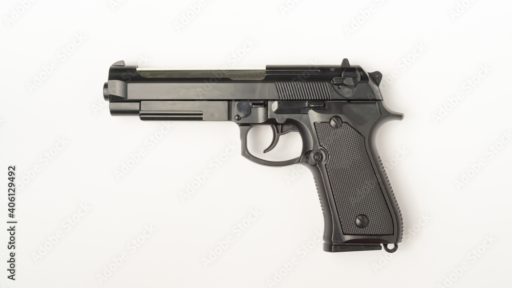 A gun on a white background. Flat lay view. A gun on a white background. Flat lay view.