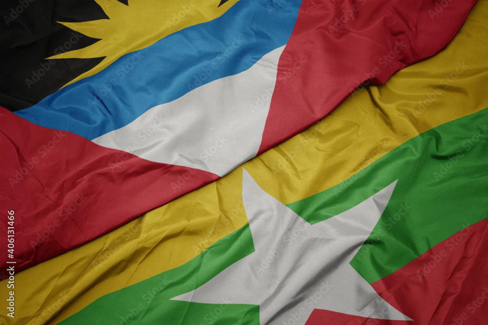 waving colorful flag of myanmar and national flag of antigua and barbuda.