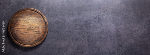 Panel kuchenny z motywem Pizza or bread cutting board for homemade baking on table. Food recipe concept at stone background texture