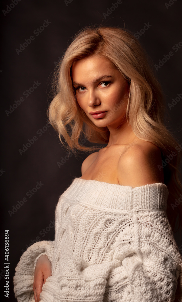 Fototapeta premium Blonde, studio portrait of a young girl