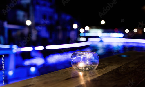 A candle in a night city lights bokeh