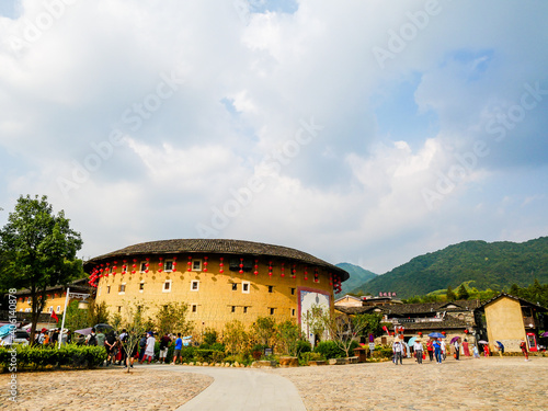 A panoramic wide angle view of Tulou courtyard,Tulou is the unique traditional rural dwelling of Hakka,located in Fujian,China © bzebois