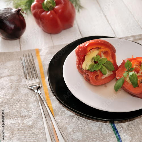 Baked halves of bell peppers stuffed with mushrooms  vegetables and cheese.