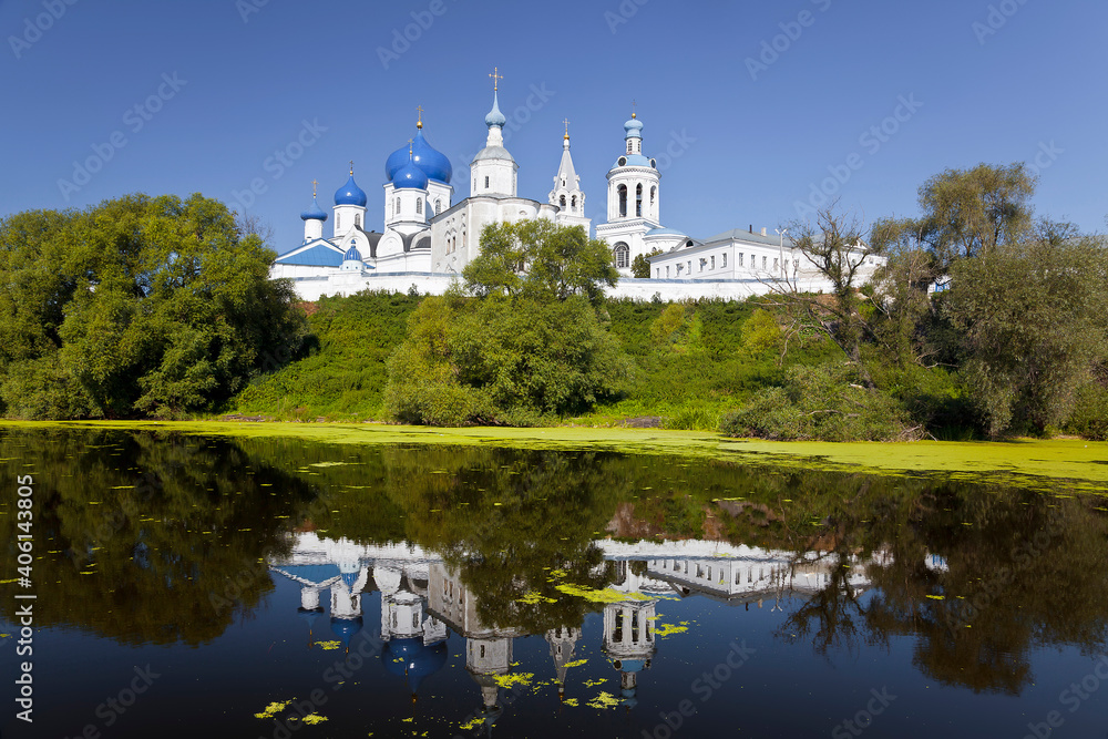 View of the Holy Bogolyubsky orthodox convent on the high bank and its reflection in the Klyazma river. Bogolyubovo, Vladimir region, Russia View of the Holy Bogolyubsky orthodox convent on the high bank and its reflection in the Klyazma river. Bogolyubovo, Vladimir region, Russia