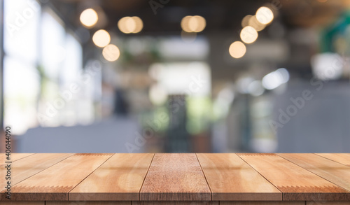 Wallpaper Mural Empty wooden table top with lights bokeh on blur restaurant background. Torontodigital.ca