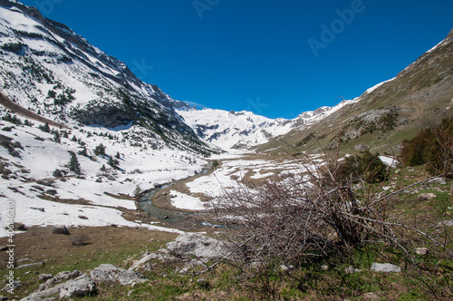 Parque nacional de Ordesa y Monteperdido. Valle de Otal. Senderismo en los pirineos en una paisaje alpino nevado photo