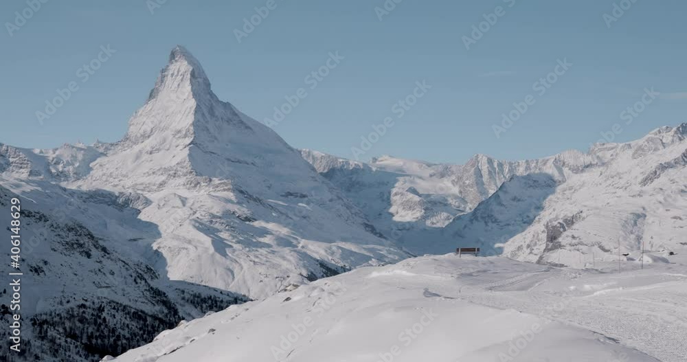 The Matterhorn face east and face north in morning light in winter, Video taken from the hiking trail from Blauherd to Fluhalp, above Zermatt in Valais, Switzerland.
The Matterhorn face east and face north in morning light in winter, Video taken from the hiking trail from Blauherd to Fluhalp, above Zermatt in Valais, Switzerland.