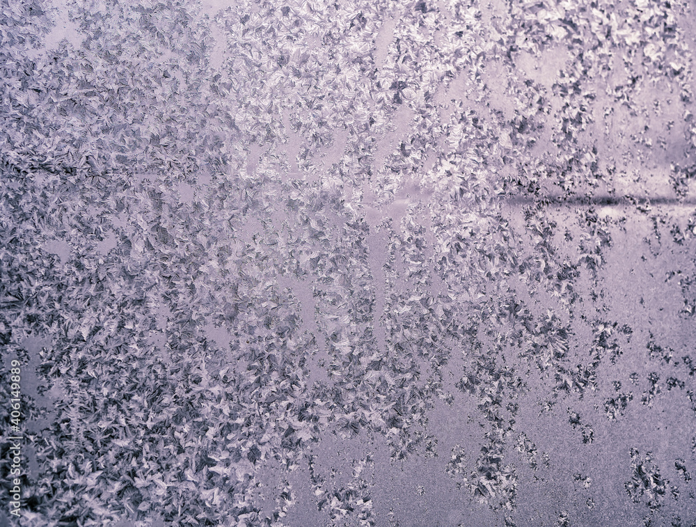 Frosty winter patterns on window glass. Close-up. Frosty winter patterns on window glass. Close-up.
