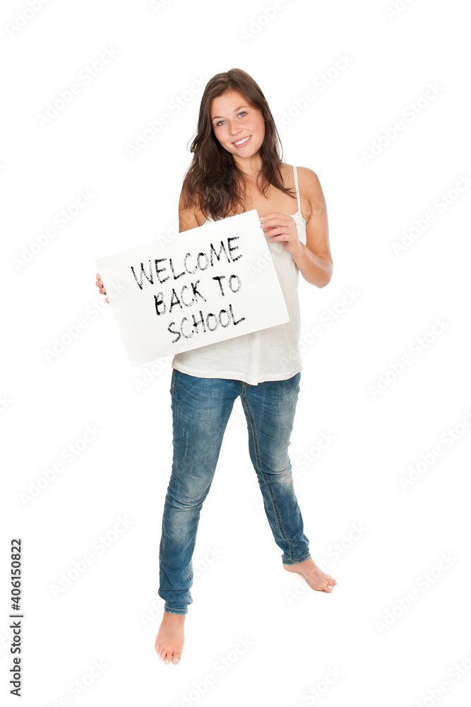 Full length portrait of an elder schoolgirl holding a placard, model is eighteen years old, welcome back to school is written on the paper, isolated on white studio background Full length portrait of an elder schoolgirl holding a placard, model is eighteen years old, welcome back to school is written on the paper, isolated on white studio background