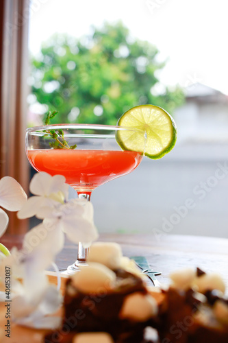 Homemade cookies brownie and marshmallow with cocktails punch served on wooden table.