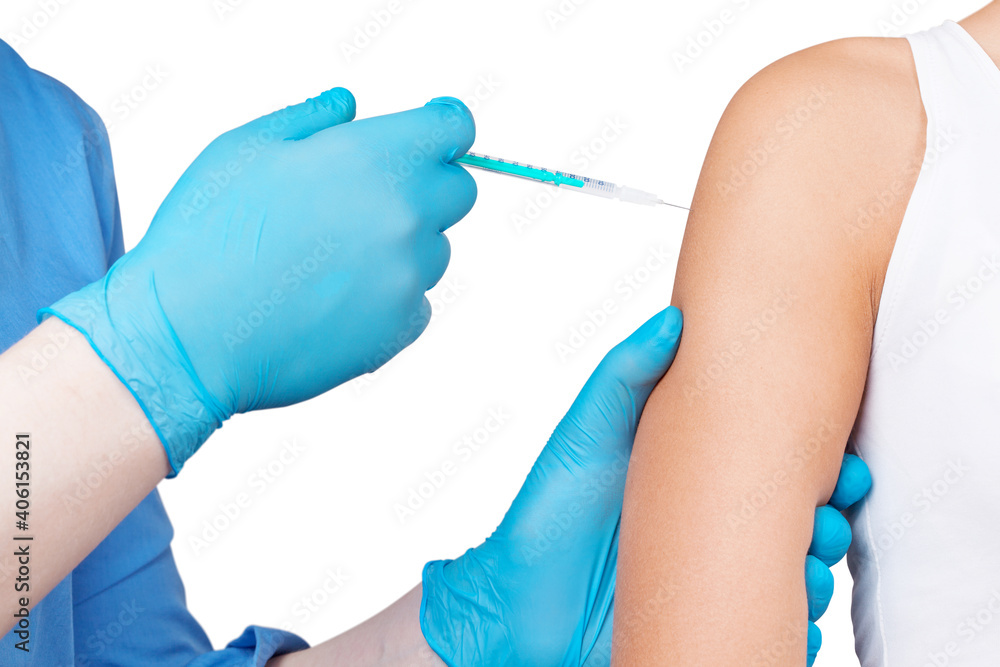 Doctor gives a syringe with vaccine to patient at clinic. Doctor gives a syringe with vaccine to patient at clinic.