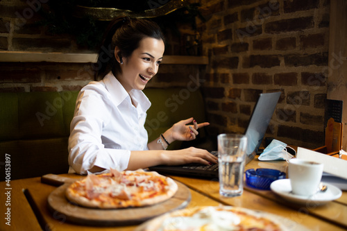 Young businesswoman Communicates with business partners using a laptop 