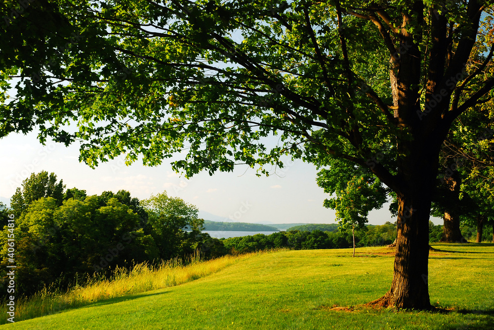A bucolic view across a river valley to the mountains A bucolic view across a river valley to the mountains