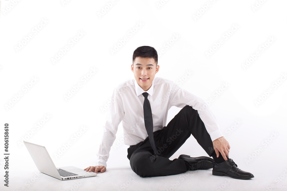 Portrait of young bisinessman sitting in the front of laptop Portrait of young bisinessman sitting in the front of laptop