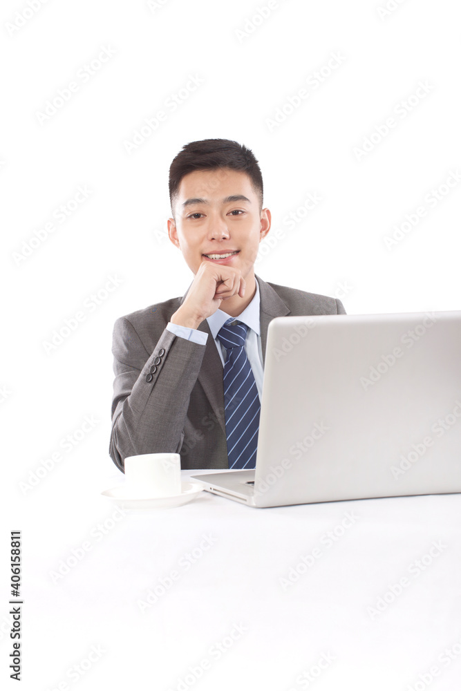 Portrait of young bisinessman sitting in the front of laptop Portrait of young bisinessman sitting in the front of laptop