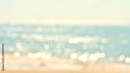 Abstract bokeh background from summer blue sea water at the beach