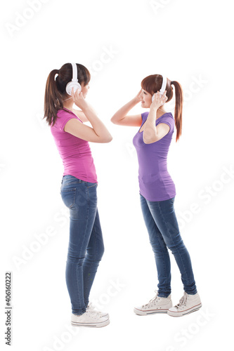 Portrait of two female friends listening music