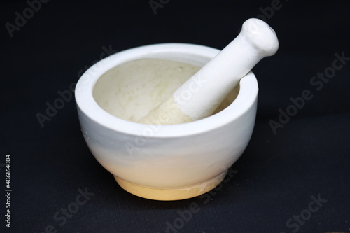 Empty ceramic  mill pot with grinding stone