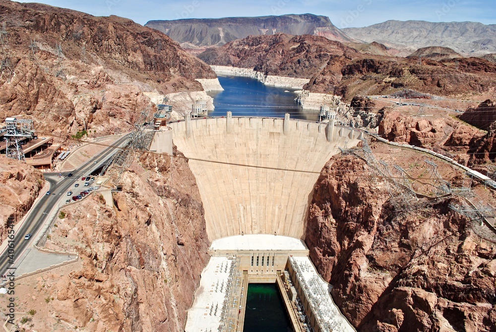 Hoover Dam as seen from the Mike O'Callaghan–Pat Tillman Memorial Bridge. The Hoover Dam is a concrete arch-gravity dam in the Black Canyon of the Colorado River. Lake Mead between Arizona and Nevada. Hoover Dam as seen from the Mike O'Callaghan–Pat Tillman Memorial Bridge. The Hoover Dam is a concrete arch-gravity dam in the Black Canyon of the Colorado River. Lake Mead between Arizona and Nevada.
