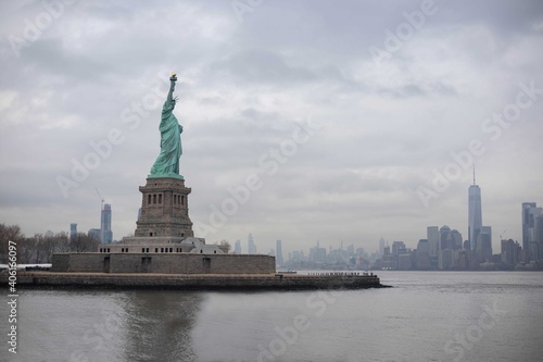 The statue of Liberty with World Trade Center background and Manhattan  New York City  USA