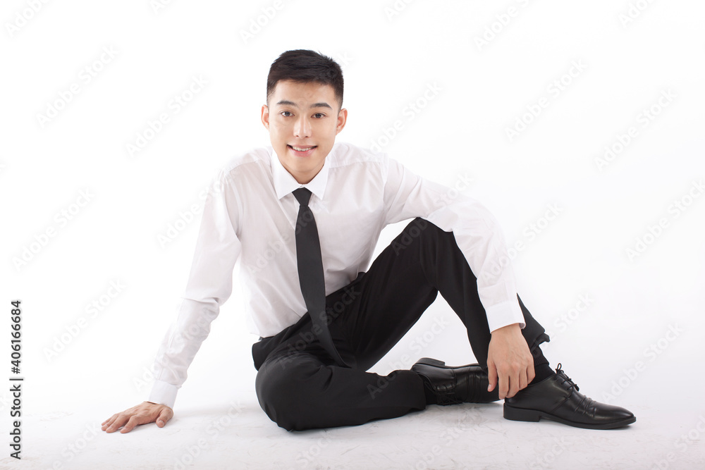 Portrait of young bisinessman sitting on floor Portrait of young bisinessman sitting on floor