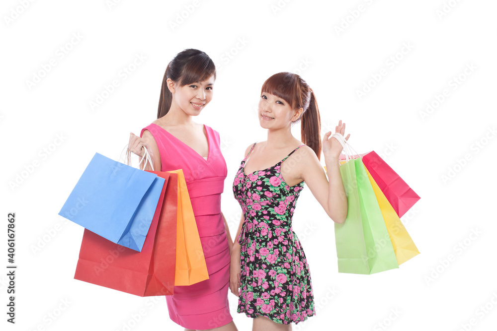 Portrait of two young female friends shopping 