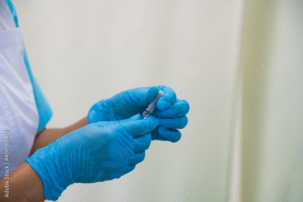 The doctor injects the flu, pneumonia, or COVID-19 vaccine into the patient's shoulder The doctor injects the flu, pneumonia, or COVID-19 vaccine into the patient's shoulder