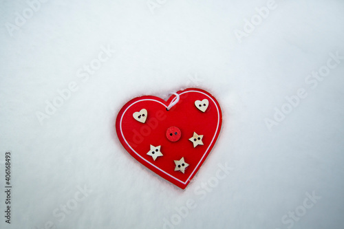 wooden photo frame heart lies on the snow
