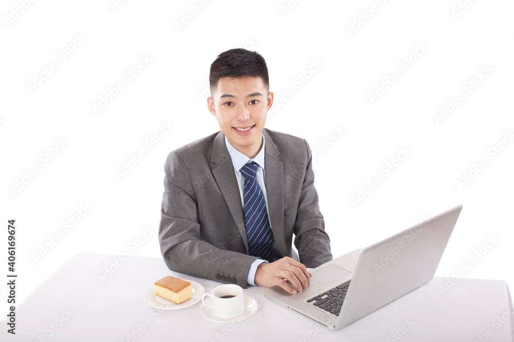 Portrait of young bisinessman sitting in the front of laptop 