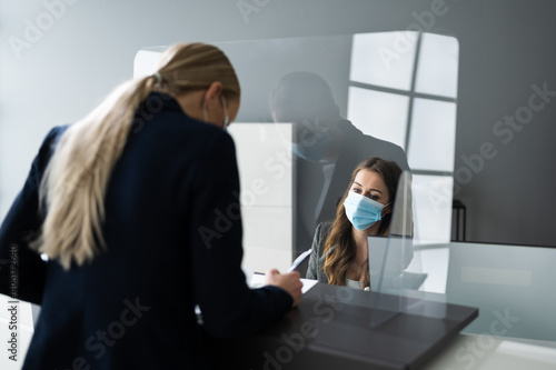 Hotel Reception Desk Protected By Medical Mask