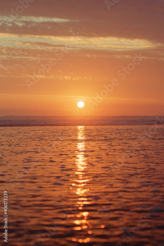 Sun reflection in the sea at sunset, beach