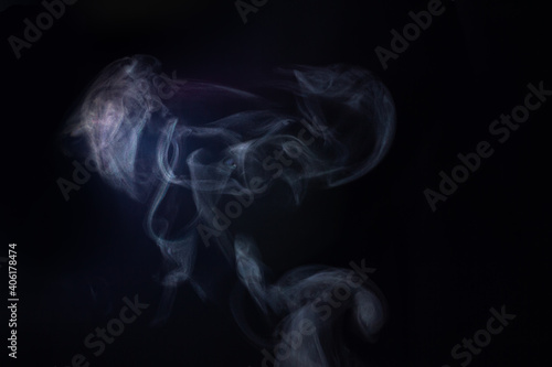 Steam from hot water on a black background