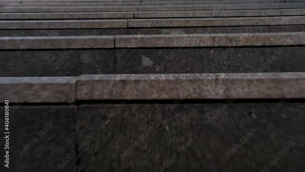 tracking camera movement of going up the stairs in the city long shot view with low angle tracking camera movement of going up the stairs in the city long shot view with low angle