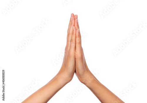 Female hands folded together isolated on white background. photo