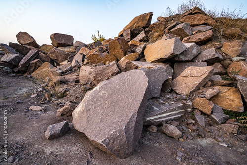 Stone materials near old flooded stone quarry