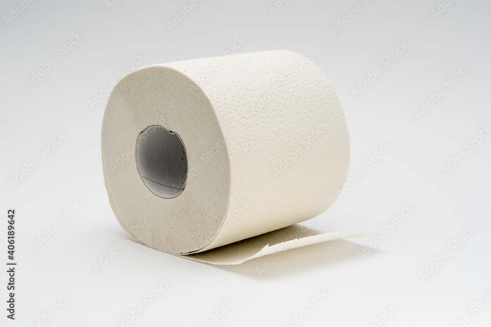 White toilet paper roll on a neutral white background. Full bathroom tissue out of recycled material. White toilet paper roll on a neutral white background. Full bathroom tissue out of recycled material.