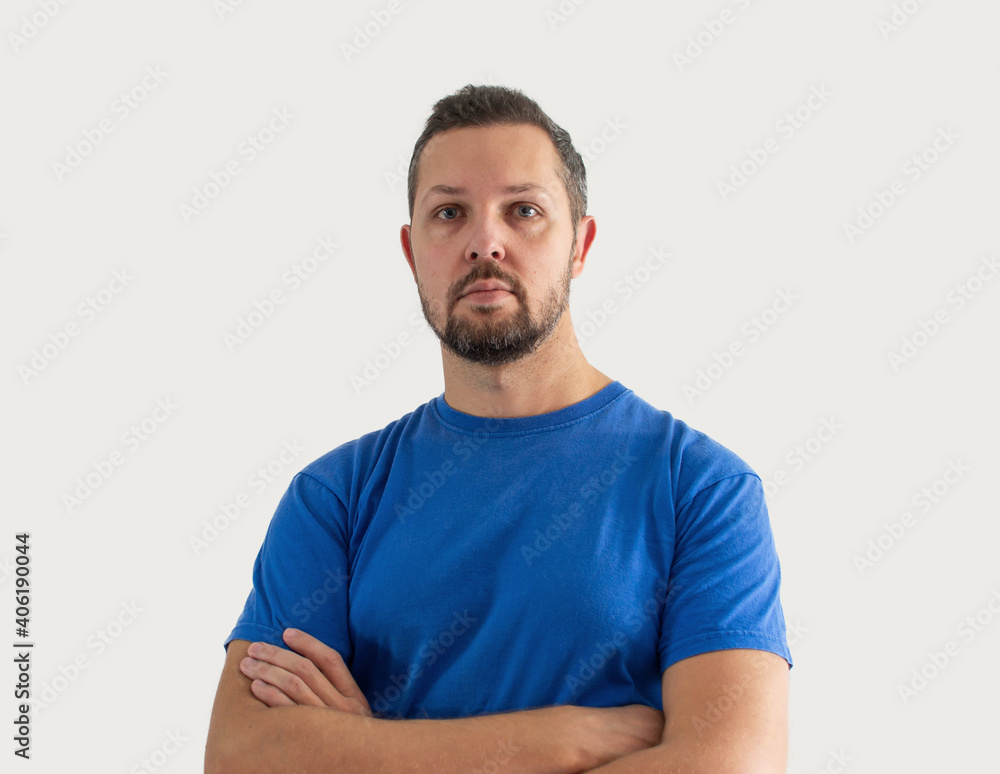 Caucasian white man portrait, isolated on background. Guy in t shirt with crossed arms. Caucasian white man portrait, isolated on background. Guy in t shirt with crossed arms.