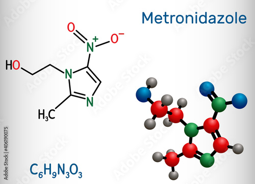Metronidazole, antiprotozoal medication molecule. It is antibiotic, belonging to the nitroimidazole class of antibiotics. Structural chemical formula and molecule model. photo