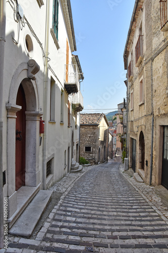 A narrow street between the stone houses of Morcone, an old town in the province of Benevento, Italy.  © Giambattista