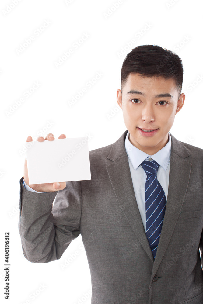 Portrait of young business man holding up blank paper Portrait of young business man holding up blank paper