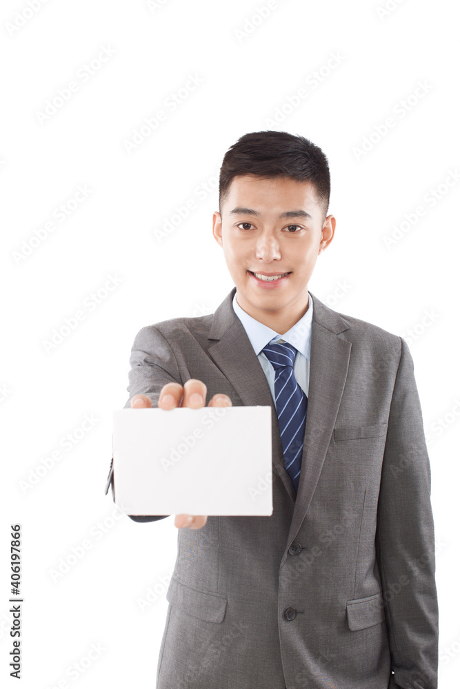Portrait of young business man holding up blank paper Portrait of young business man holding up blank paper