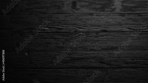 Black wooden background. Free space for your text. Top view.