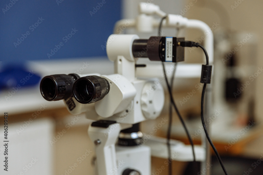 View of the ophthalmic microscope on the table in the ophthalmologist's office. Modern diagnostics and treatment of vision. Diagnostic microscopic medical equipment.