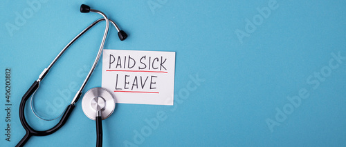 medical phonendoscope with the inscription paid sick leave on a blue background