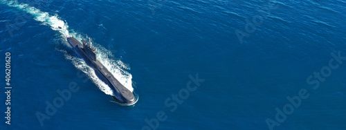 Aerial drone ultra wide panoramic photo of latest technology armed diesel powered submarine cruising half submerged photo