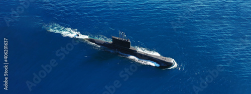 Aerial drone ultra wide panoramic photo of latest technology armed diesel powered submarine cruising half submerged