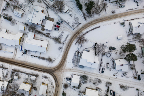 Drone angle view of snowy suburban streets and houses in Finland