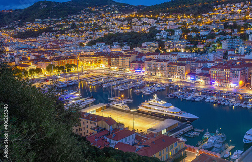 Idyllic view oа entrance to harbor - Rade de Villefranche in Nice - night scene with illumination