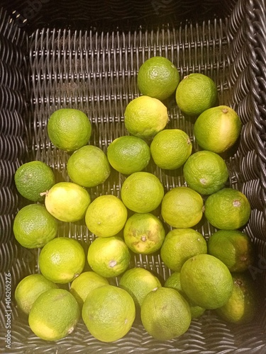 lemons and limes in basket